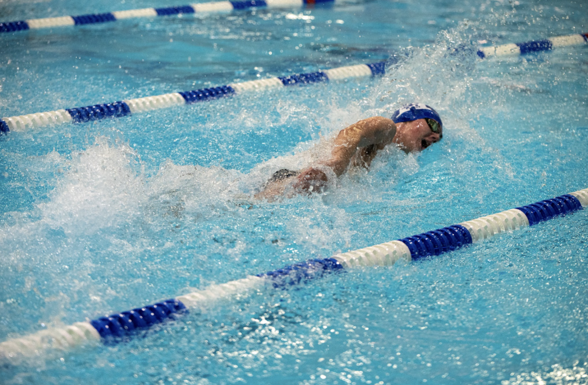 Charlie Golden (10) swims his final lap of his 500 free.